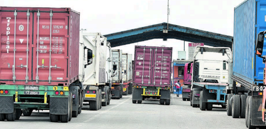 File: Trailer trucks wait in line outside the Port of Point Lisas, Atlantic Avenue, Couva. PHOTO BY KERWIN PIERRE
