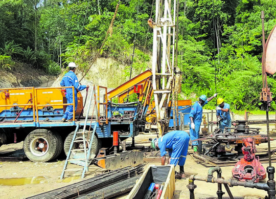Workers install equipment at a Predator Oil and Gas field in Trinidad. PHOTO COURTESY PREDATOR OIL AND GAS