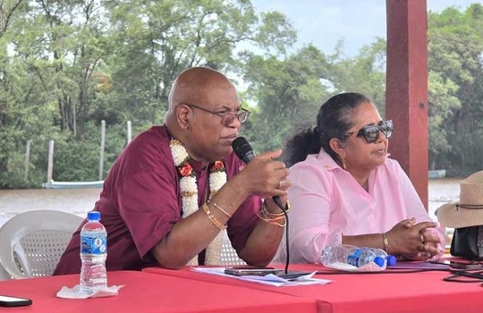 Minister Edghill speaking at the meeting. Also pictured is Region Two Chairperson Vilma DeSilva - Guyana Chronicle 
