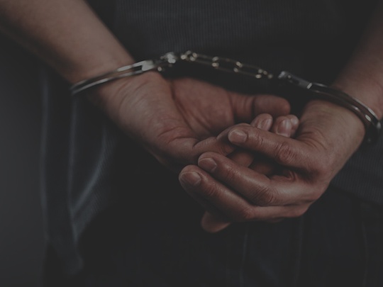 Man in Handcuffs - 123RF