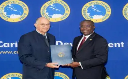 CDB’s Vice-President of Operations Dr Isaac Solomon (right) and Dominique Hautbergue, director for Brazil and the Southern Cone Regional Division, Agence Française de Développement (AFD).