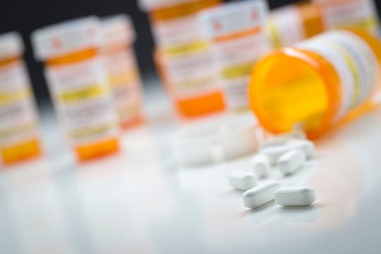 Pill containers concept - 123RF