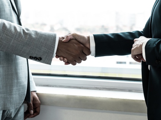 Business handshake - 123RF