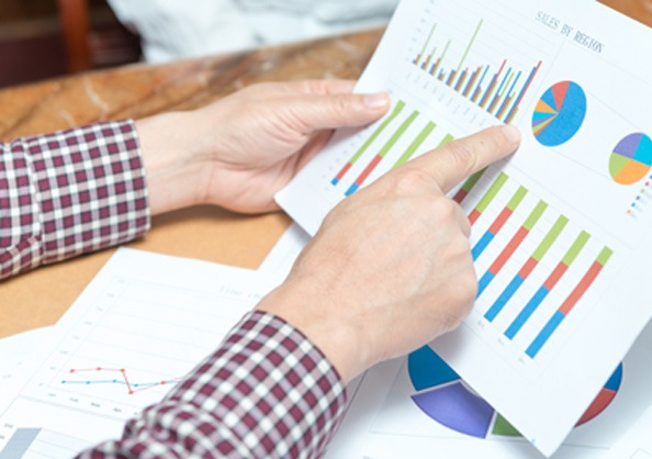 Person Pointing at Graph