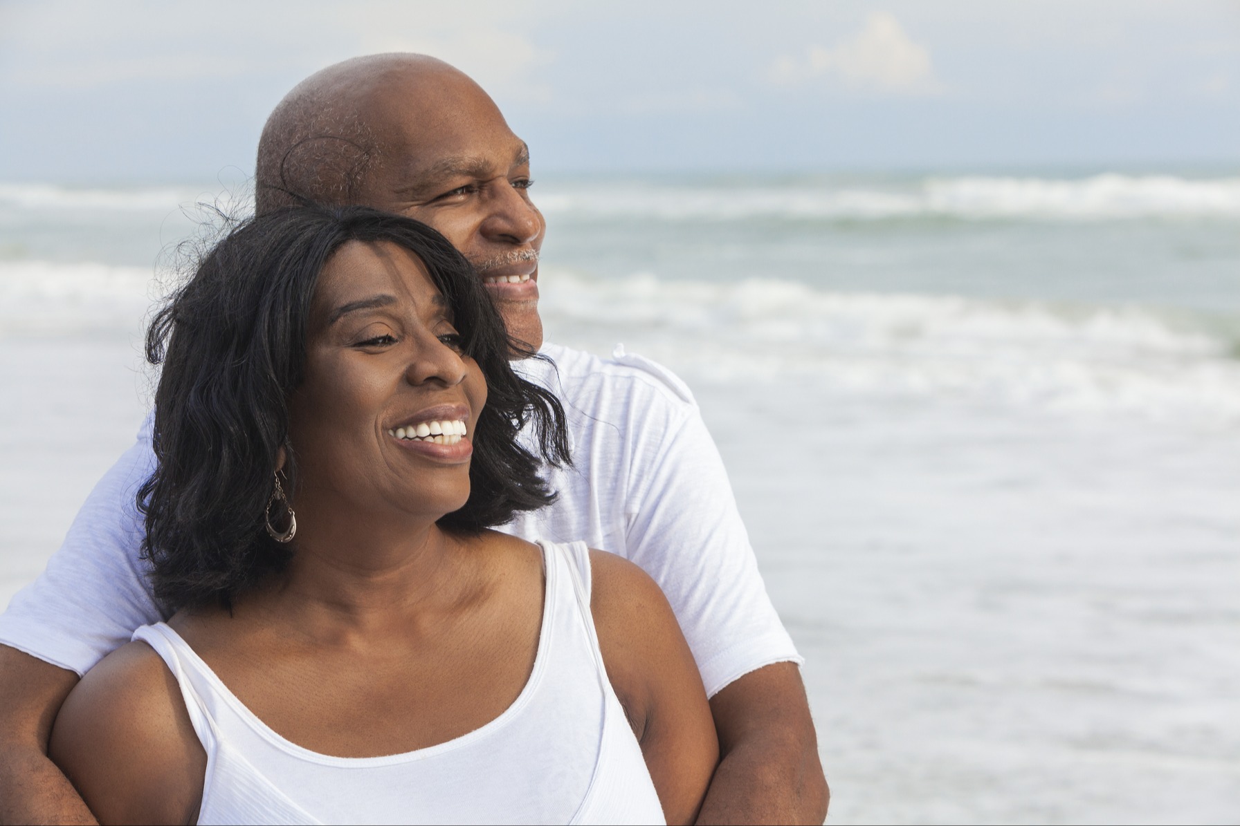 Happy senior couple on the beach 