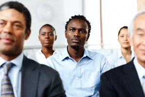 professional people sitting in rows listening to a presentation