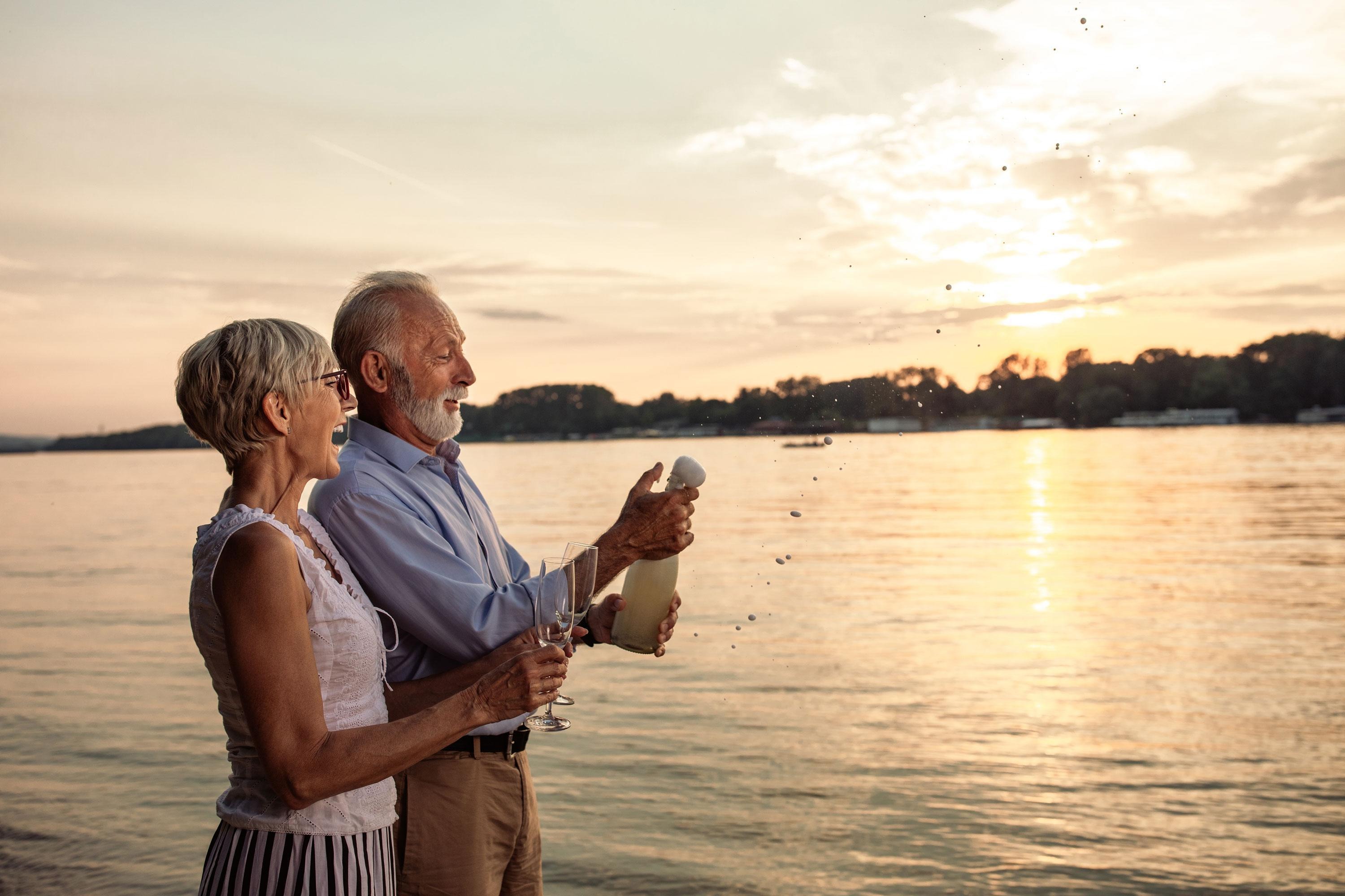 Couple on beach celebrating 
