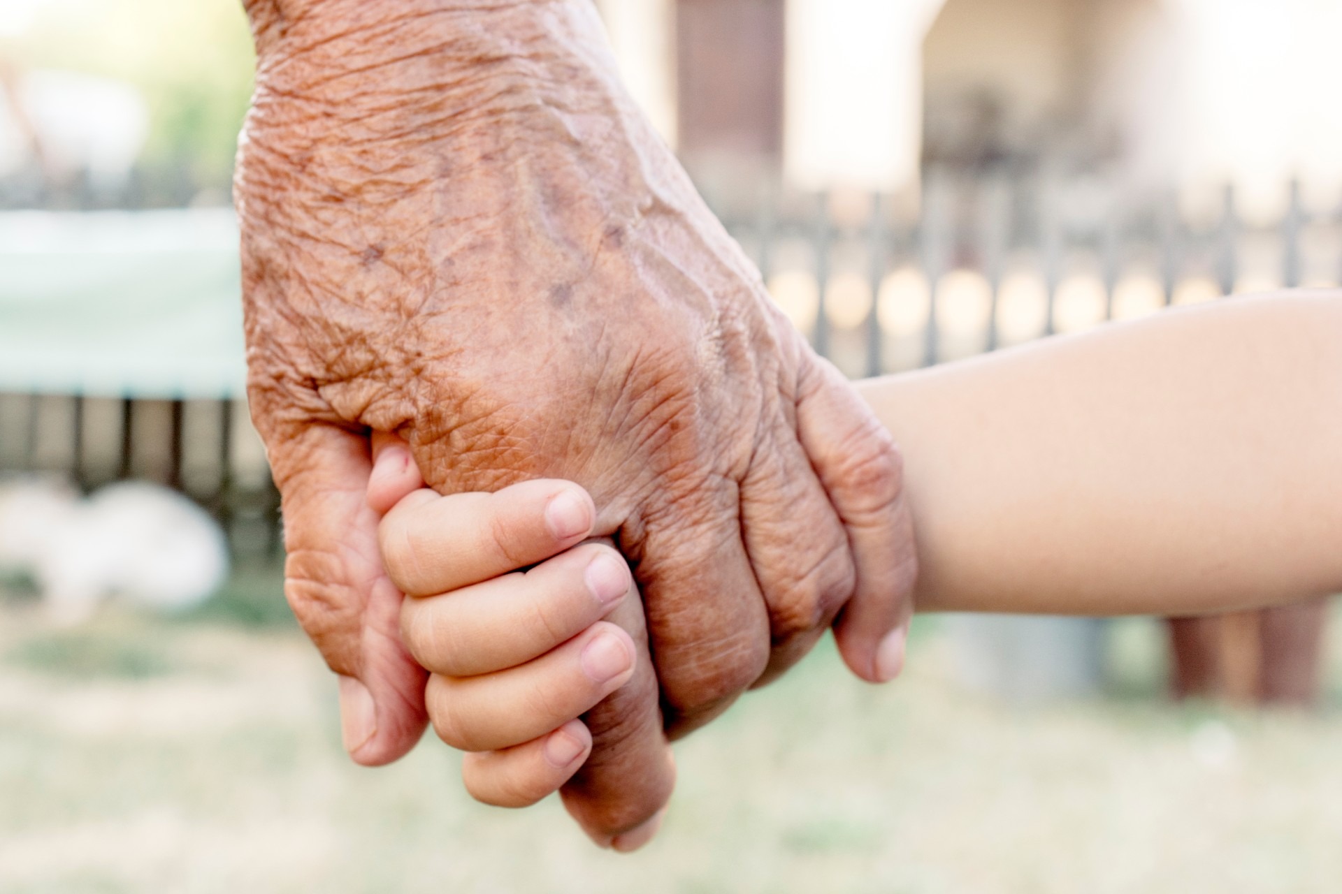 grandparents-hand-holding-grandchilds-hand