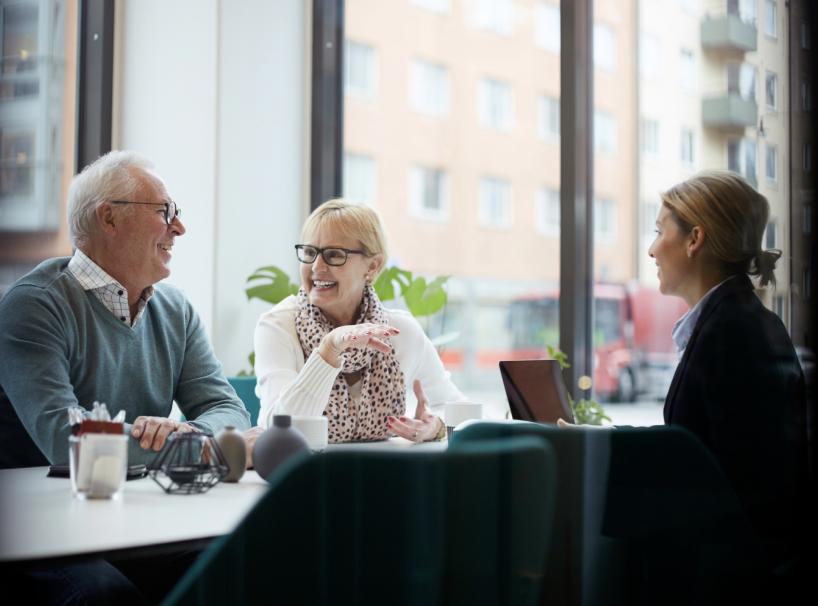Elderly couple working with advisor