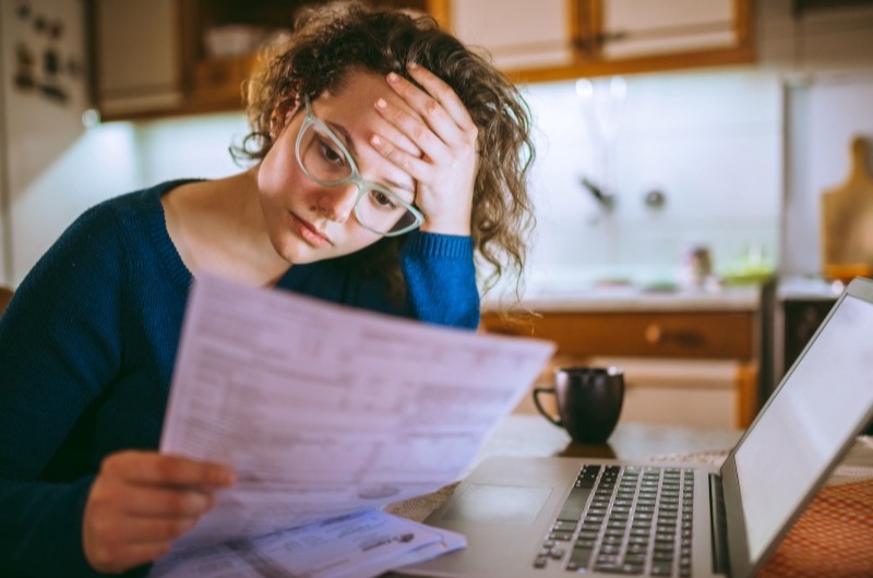 Woman reading tax documents