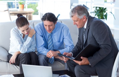 Three business people sitting