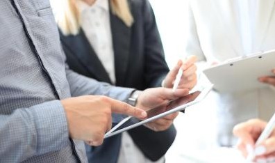 Office People looking at a tablet
