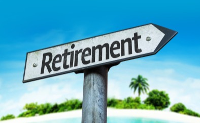 Retirement sign with a beach in the background