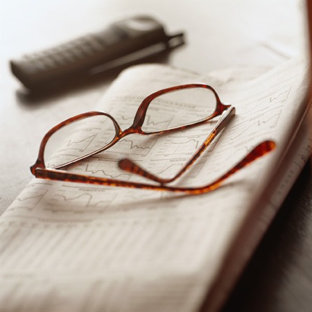 eyeglasses, telephone, newspaper