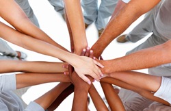Several different people's hands joining