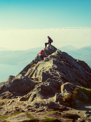 man-standing-on-mountain