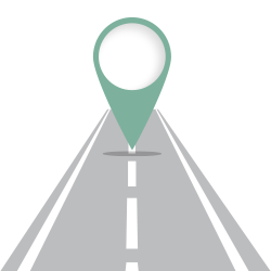 A map pin placed on a road, symbolizing a marked point of interest or navigation.