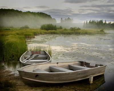 Two small boats near water