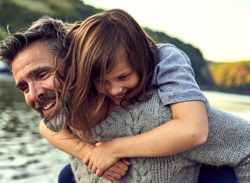 Father with daughter on shoulders