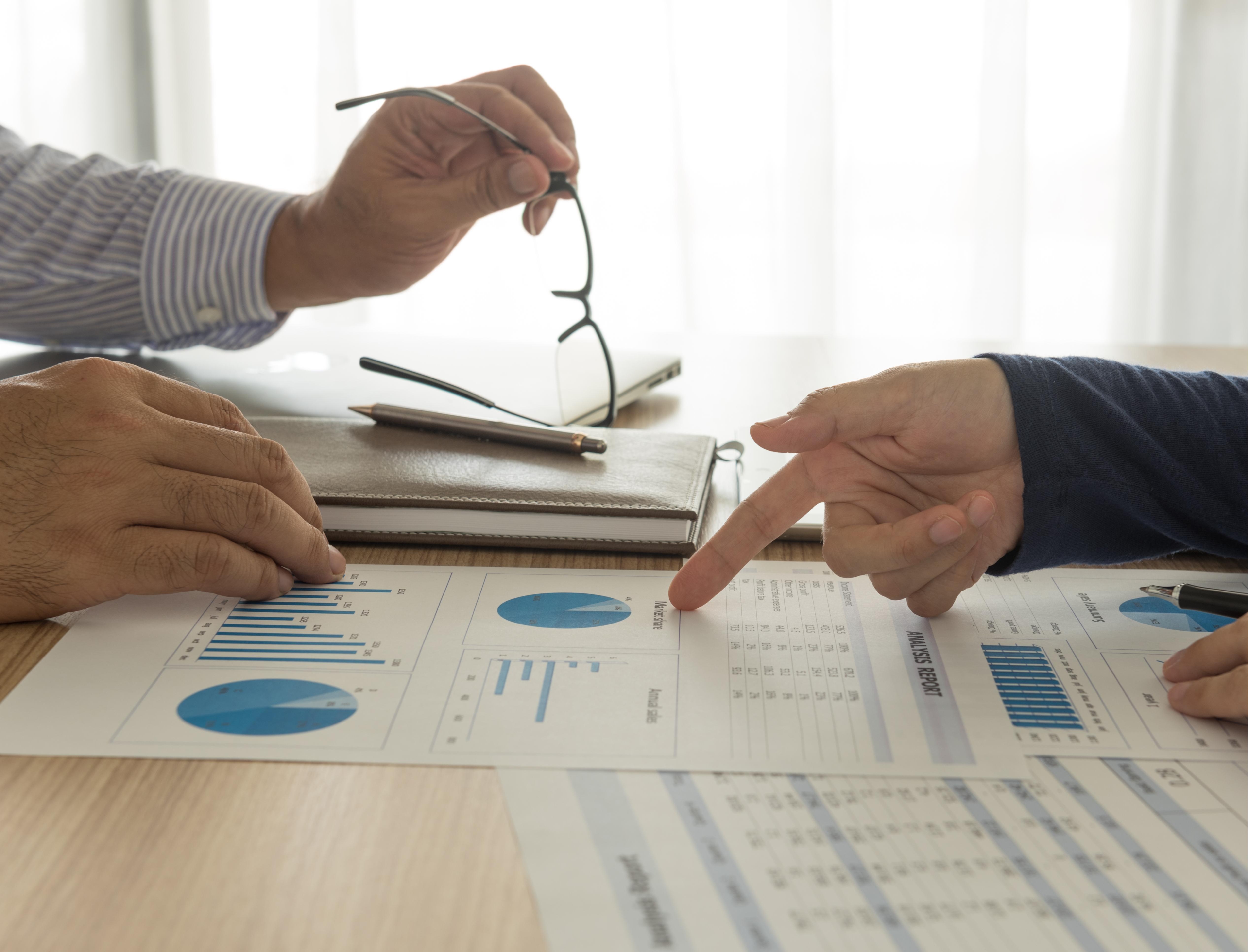 Looking over charts during a meeting