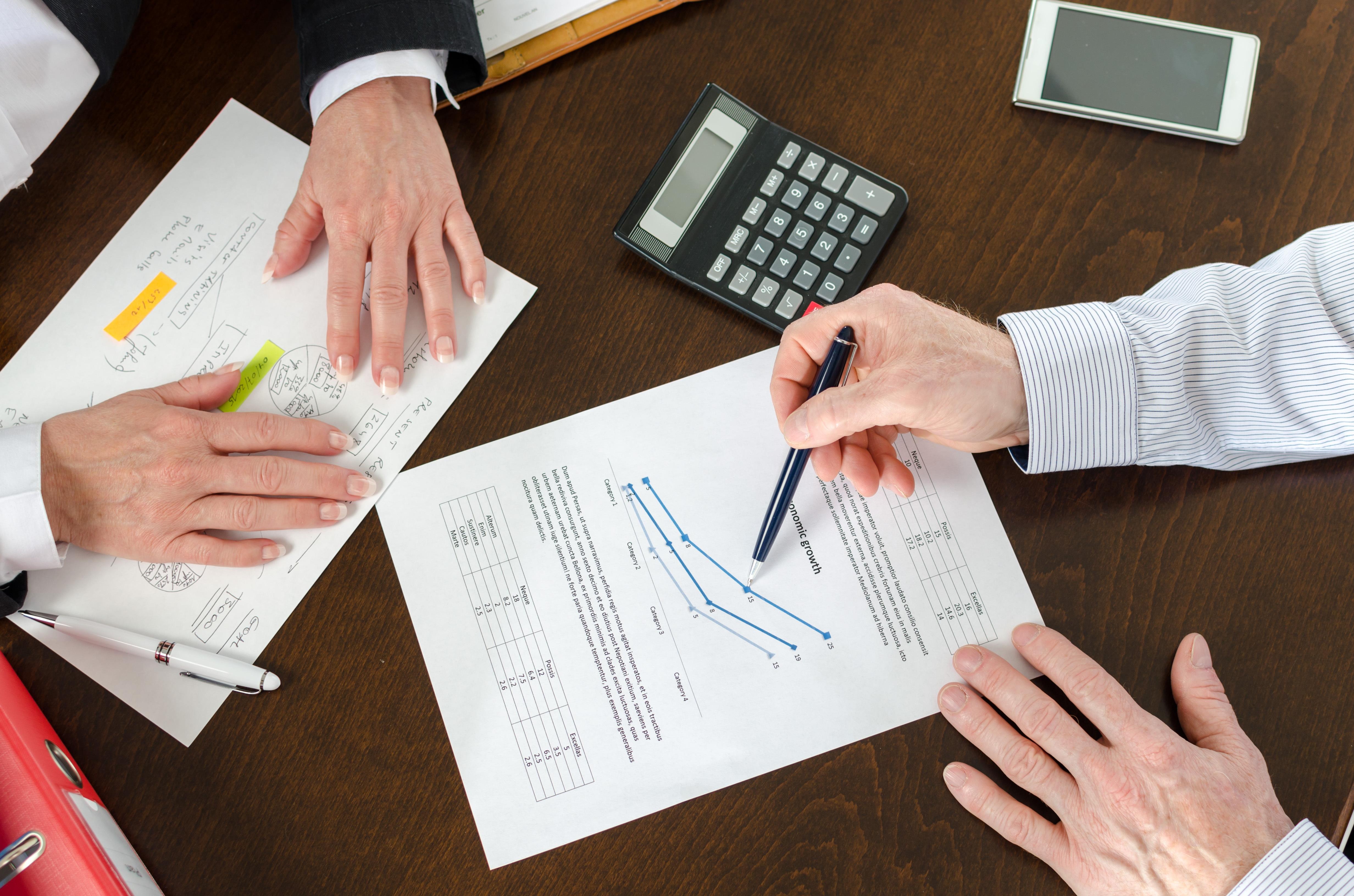 Office - Reviewing charts during a meeting