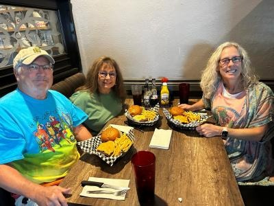 Jay Financial Team celebreating Jimmy Buffet Friday with a meal together