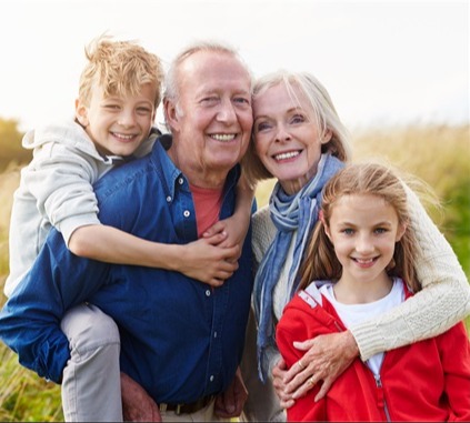Grandparents taking their two young grandchildren out to spend time in nature, focusing on what matters most