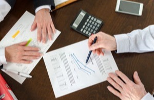 two business people analyzing data