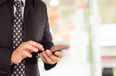 Man typing on his phone