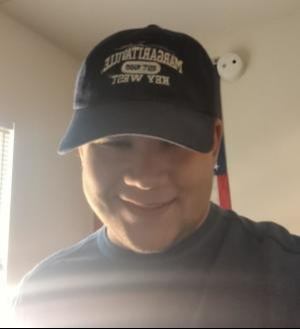 a Jay Financial Team member wearing a Jimmy Buffet Hat