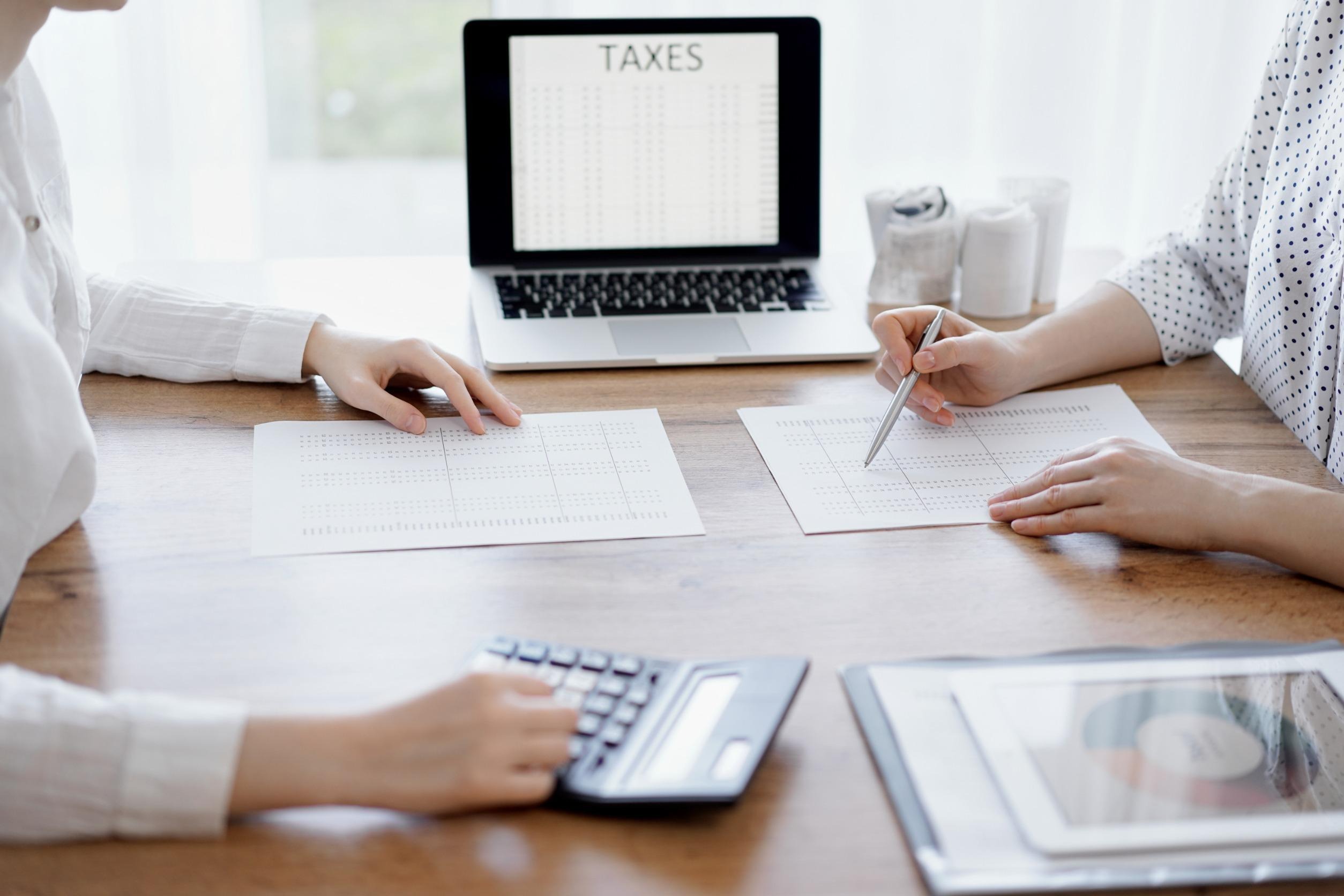 two people reviewing their taxes together