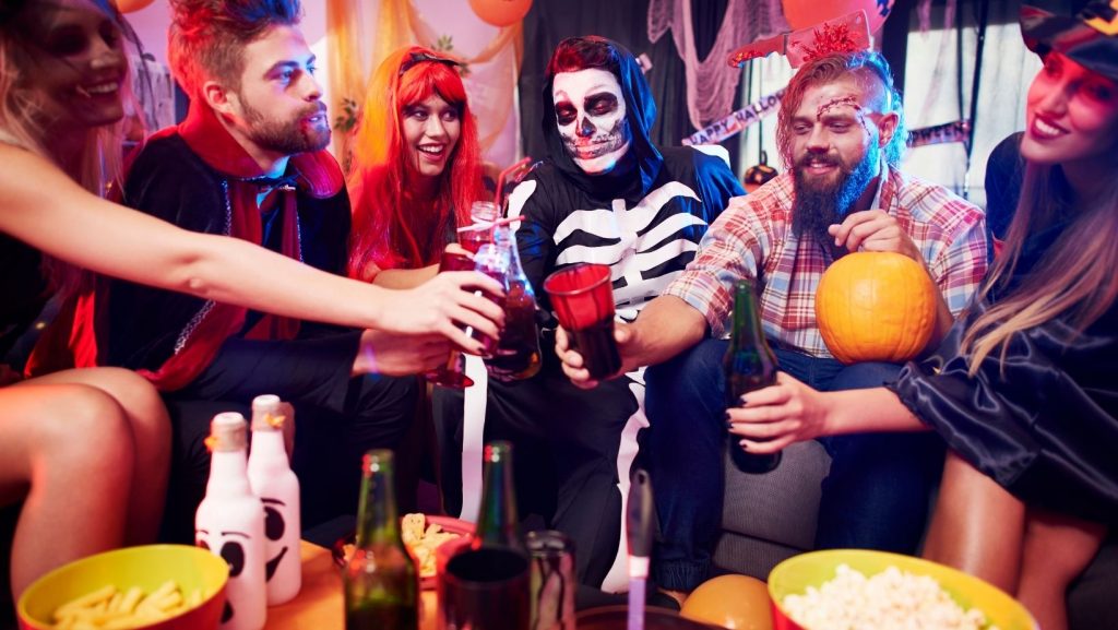 Halloween photo featuring people dressed up in costumes at a party