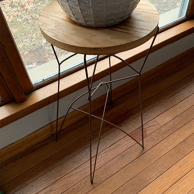 Small meta stool with a plan setting on it