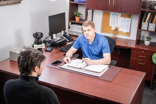 A probation officer talking to a person on probation