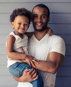 A father holding his toddler son