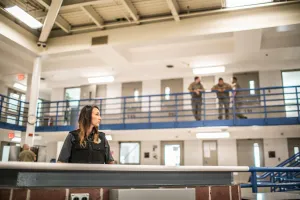 bop_2025_officer_officers_monitoring_a_cell.jpg