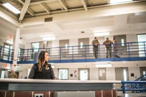 bop_2025_officer_officers_monitoring_a_cell.jpg