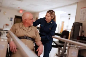 doctor helping patient