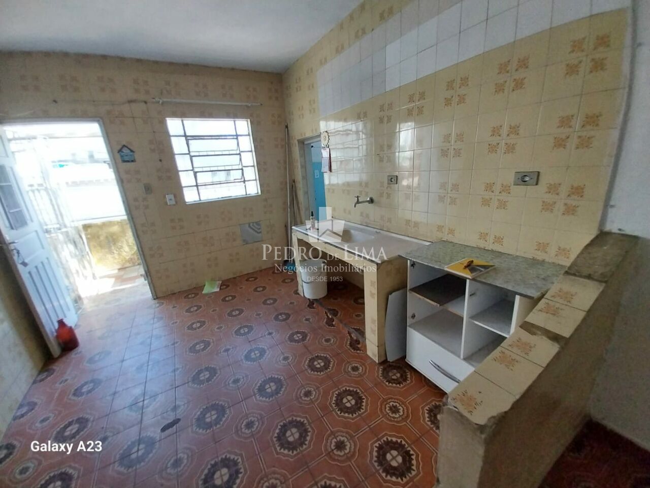 Terreno com 3 sobrados em Itaquera