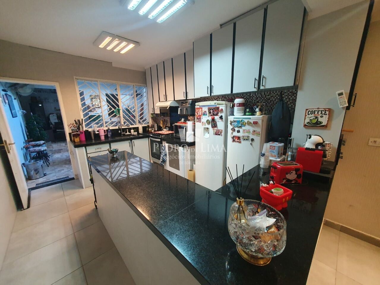 Casa de Vila no Tatuapé com 140m², 3 suítes, área com churrasqueira e forno de pizza.