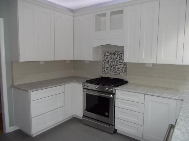 Medford, NJ - In our Medford kitchen, Cambria countertops in "Berwyn", back-splash field of 3x9 ocean surf gray tiles, and hexagonal river bed marble and glass decorative area over the range. Medford, NJ - In our Medford kitchen, Cambria countertops in "Berwyn", back-splash field of 3x9 ocean surf gray tiles, and hexagonal river bed marble and glass decorative area over the range.