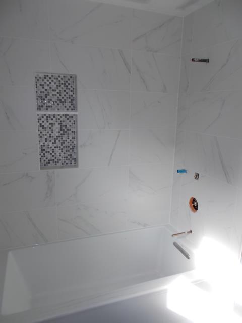 Marlton, NJ - In our Marlton bathroom, the tilework is bringing this shower/tub alcove to life with a mosaic niche and carrara look on the walls. Marlton, NJ - In our Marlton bathroom, the tilework is bringing this shower/tub alcove to life with a mosaic niche and carrara look on the walls.