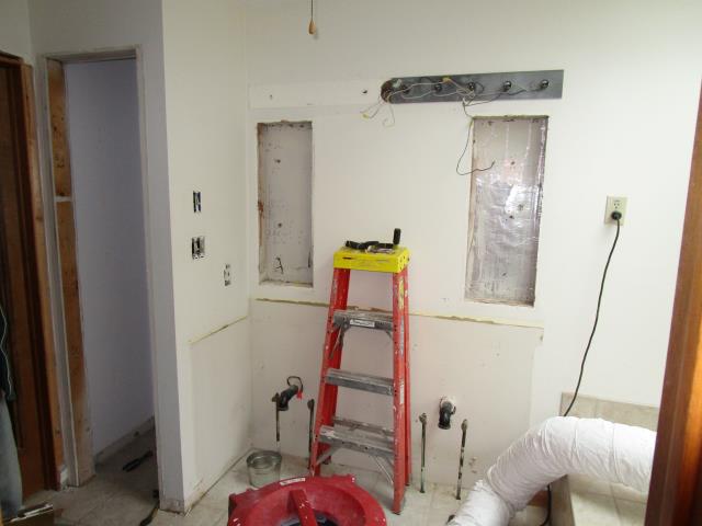 Medford, NJ - In the Highbridge neighborhood of Medford, our master bathroom renovation is underway. Here, demolition of the double vanity has begun, after site protection and dust mitigation was setup. Medford, NJ - In the Highbridge neighborhood of Medford, our master bathroom renovation is underway. Here, demolition of the double vanity has begun, after site protection and dust mitigation was setup.