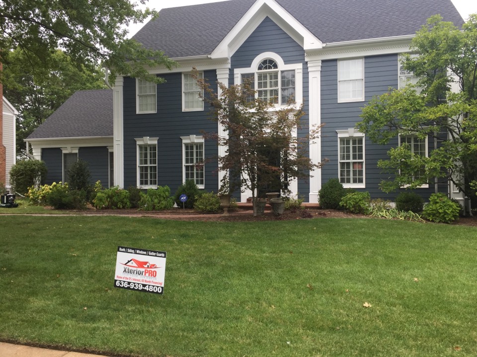Kirkwood, MO - Installing James Hardie Beaded Colonial smooth siding and pvc decorative trim details on this 2 story home. Kirkwood, MO - Installing James Hardie Beaded Colonial smooth siding and pvc decorative trim details on this 2 story home.