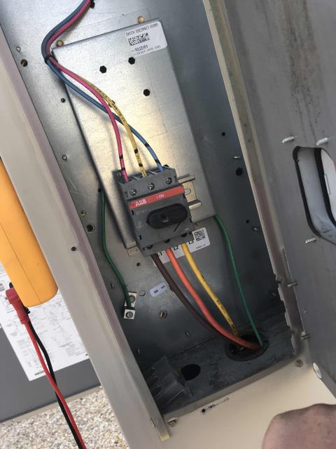 A home goods store in Valencia, CA, received a report from their electrician about blown fuses on one of their commercial air conditioners. Our technician arrive and pinpointed RTU #3 with a defective disconnect switch. Switch is shorting out and causing the compressor to single phase and blow fuses. The tech checked the electrical continuity at both compressors and blower motor and found no issues. The compressor harness plug was melted, showing signs of over heating. Will need a new compressor harness plug and disconnect switch. Sourcing parts, will quote needed repairs to customer, one unit non-operational.