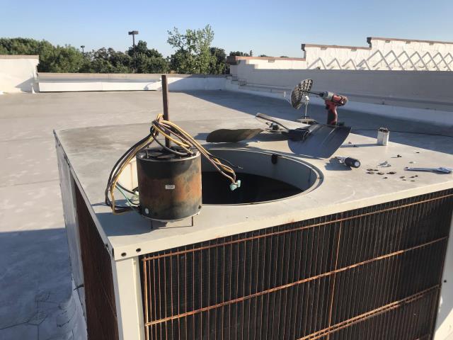 Our Modesto California HVAC tech returned to a phone store to complete approved work. After checking in with the manager and powering down the Carrier unit, he removed the failed condenser fan motor and old capacitor, and replaced both. Powered unit back up and cycled on in cooling. System is back up and running as expected, with a 21 degree temperature split. 
