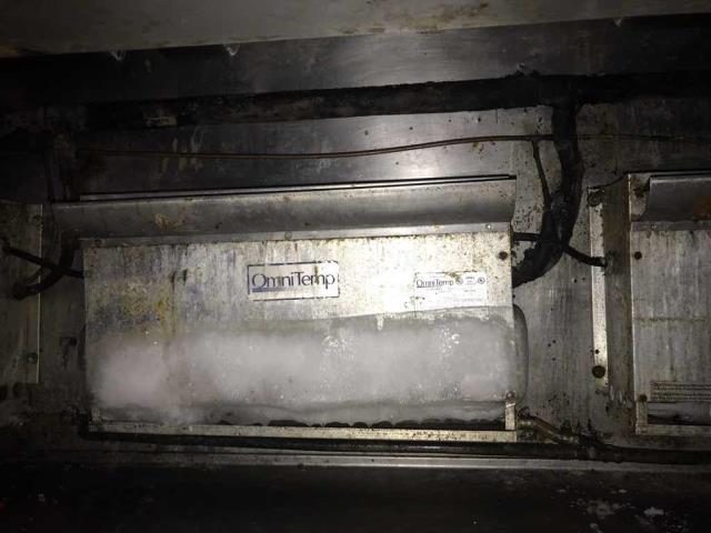 A restaurant in Anaheim California requested service. Their expo table had two fans that were frozen over solid with ice. Our technician troubleshooted the system, finding the suction pressure dropping. Noted that the line-set is incorrectly sized at the discharge line, and the defrost clock was set for 6 hours at night without any during the day, and that it was wired incorrectly to not shut down the compressor. Will  need to source necessary parts and quote to repair.