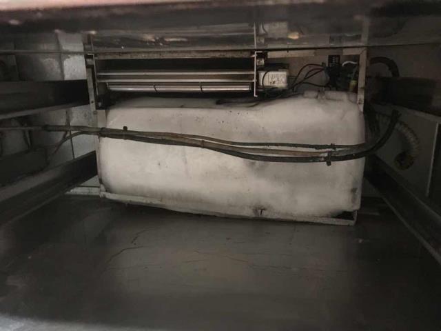 Our Palmdale CA area refrigeration technician troubleshooted a cook line unit that wasn't working correctly. He found the evaporator cover had fallen off and was blocking airflow, icing up the system. De-iced the unit, cleared out the water and reset the cabinet with new screws. System running at 35 degrees, no more issues to report.