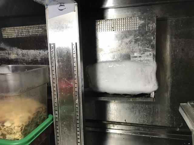 A restaurant in Dublin, California, reported their AC unit leaking, and the sandwich counter not holding temperature. Our commercial technician found the second evaporator coil frozen, and the rooftop section with clogged filters and a worn belt. This situation was causing the water leak. He was able to defrost the evaporator and clear a clog from the drain line. Unit is operating partially, will need to quote additional repairs.