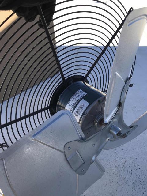 Commercial HVAC technician returned to a Palmdale, CA, mobile provider store to complete approved work. The technician checked in with the manager and went up to the roof, replacing the failed condenser fan motor on the 2nd Carrier air conditioner. Tested system, confirmed operations normal and site cool.